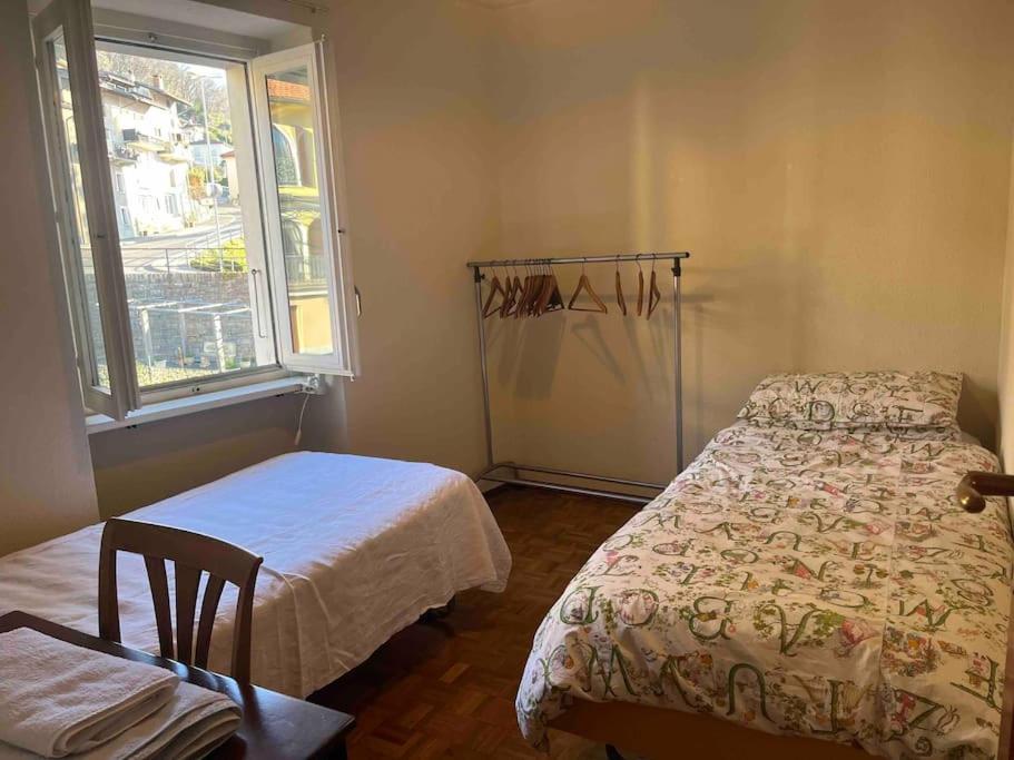 Postel nebo postele na pokoji v ubytování Sunny apartment in Lugano