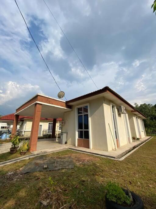 a small white house with at BTS Modern Homestay Retreat in Mantin