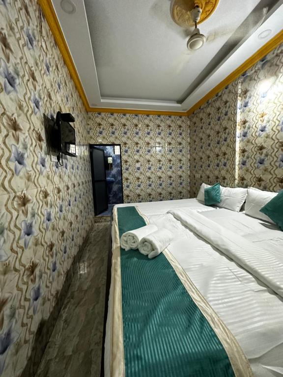 Postel nebo postele na pokoji v ubytování Baga Beachway, GuestHouse