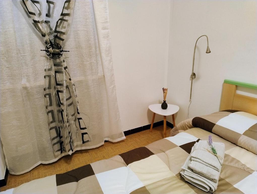 Postel nebo postele na pokoji v ubytování Casa vacanze LAGHI E MONTI