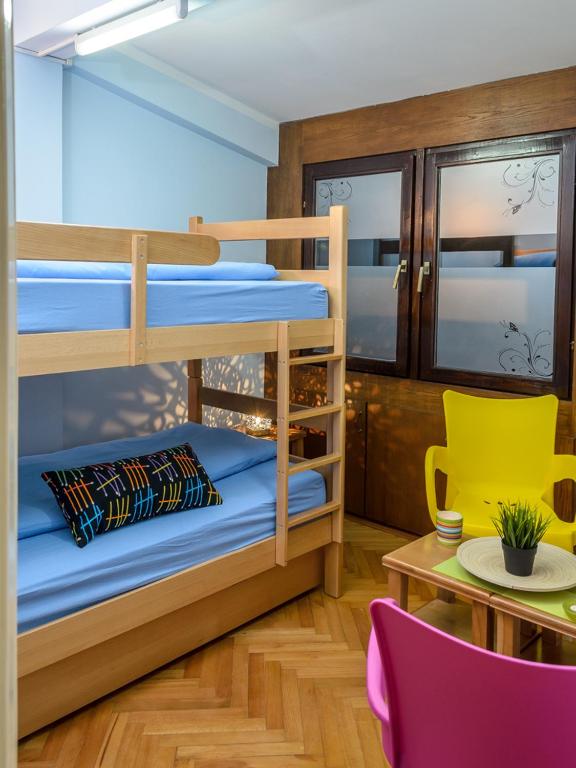 Postel nebo postele na pokoji v ubytování Hostel White Town