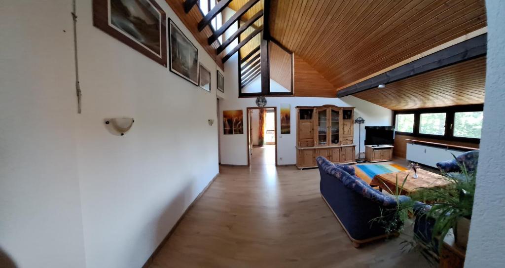a living room with a couch and a table at Ferienwohnung Heckenäcker in Ortenberg