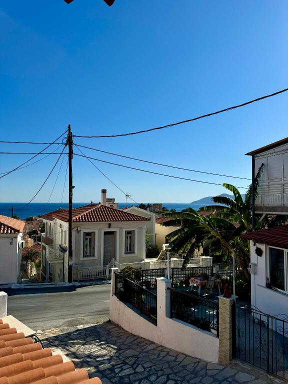 a view of a street in a town with houses at Onar Seaview Apartment in Pythagorio in Pythagoreio