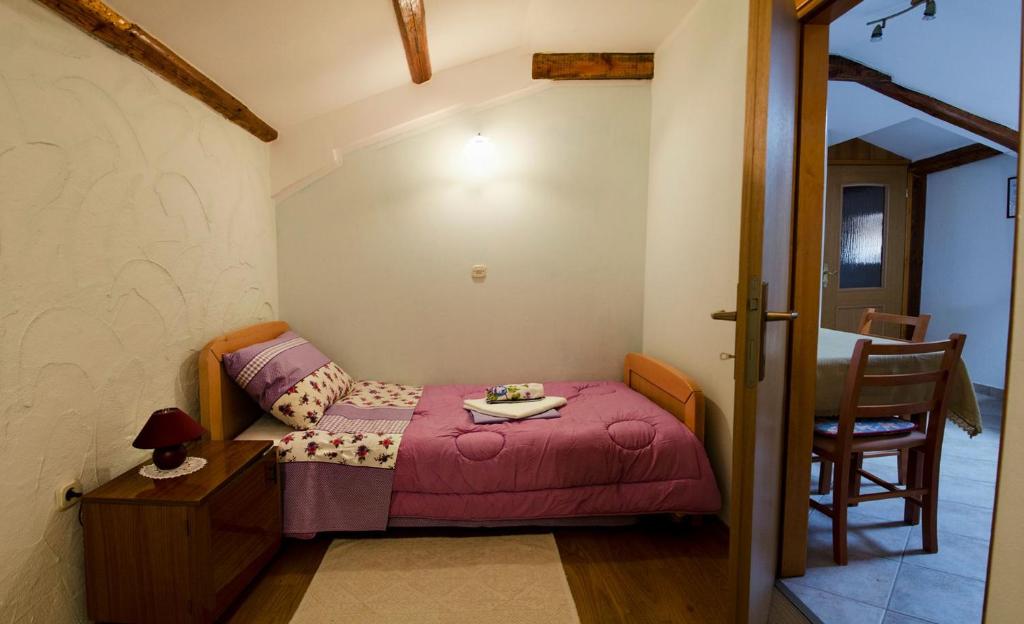 Postel nebo postele na pokoji v ubytování Apartments Percic