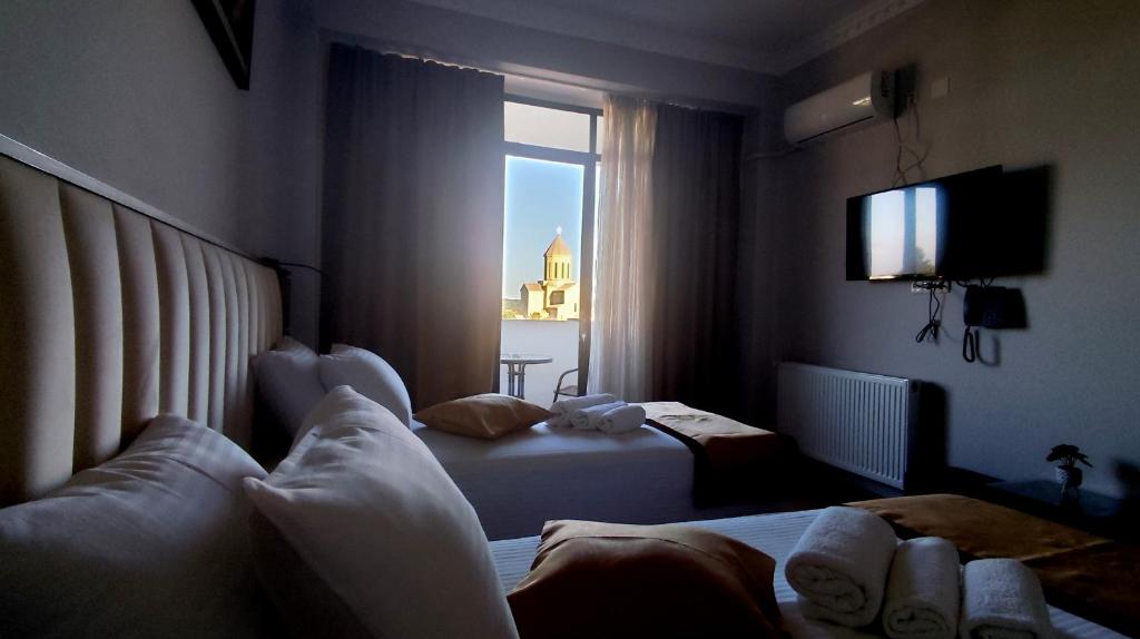 TV a/nebo společenská místnost v ubytování Hotel Red Tower