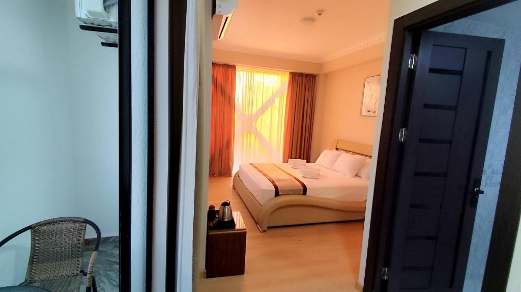 Postel nebo postele na pokoji v ubytování Hotel Red Tower