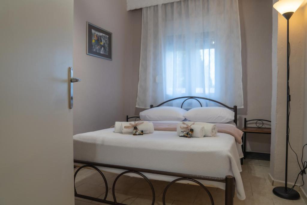 Postel nebo postele na pokoji v ubytování Roots House Pozar