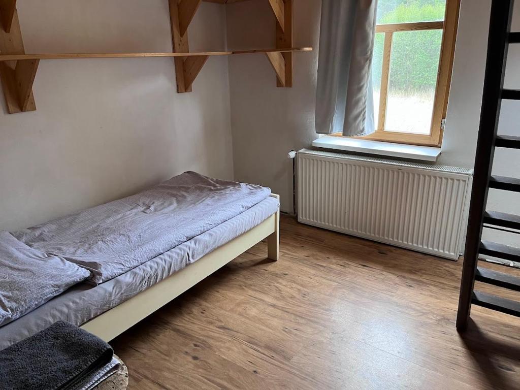 Postel nebo postele na pokoji v ubytování Chata pod hradem