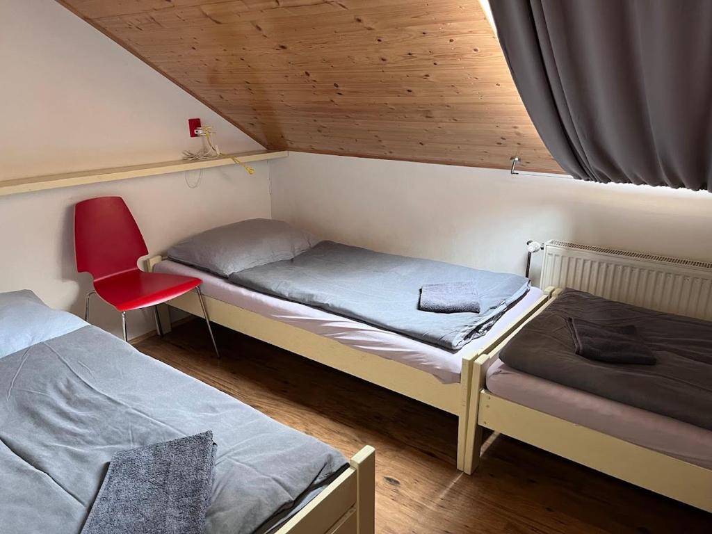 Postel nebo postele na pokoji v ubytování Chata pod hradem