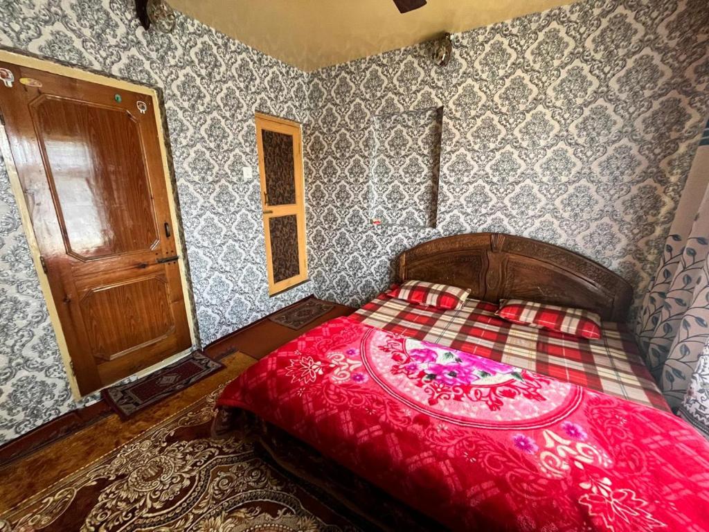 Postel nebo postele na pokoji v ubytování shahin heritage and homestays