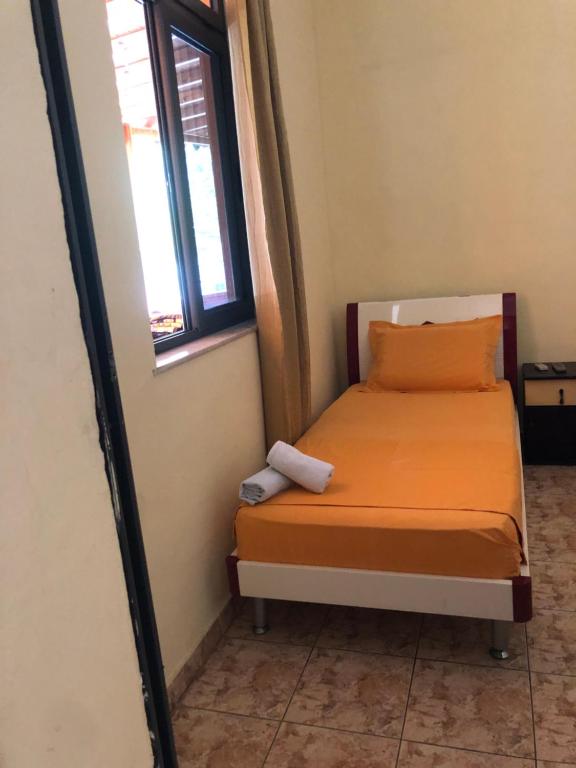 Postel nebo postele na pokoji v ubytování Hotel Xhej