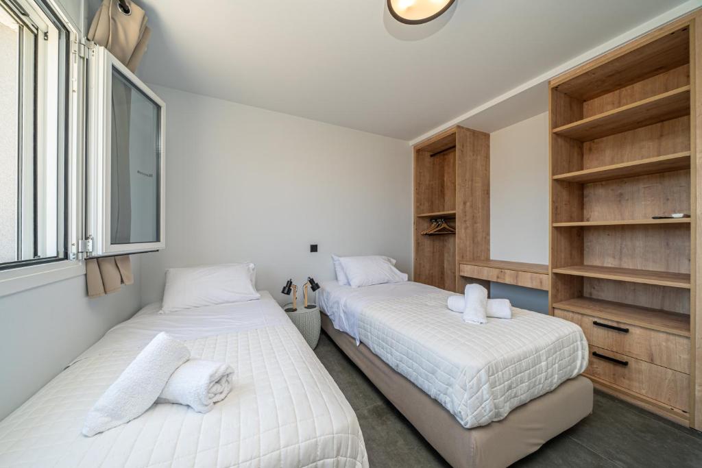 Postel nebo postele na pokoji v ubytování Pecora Nera apartments