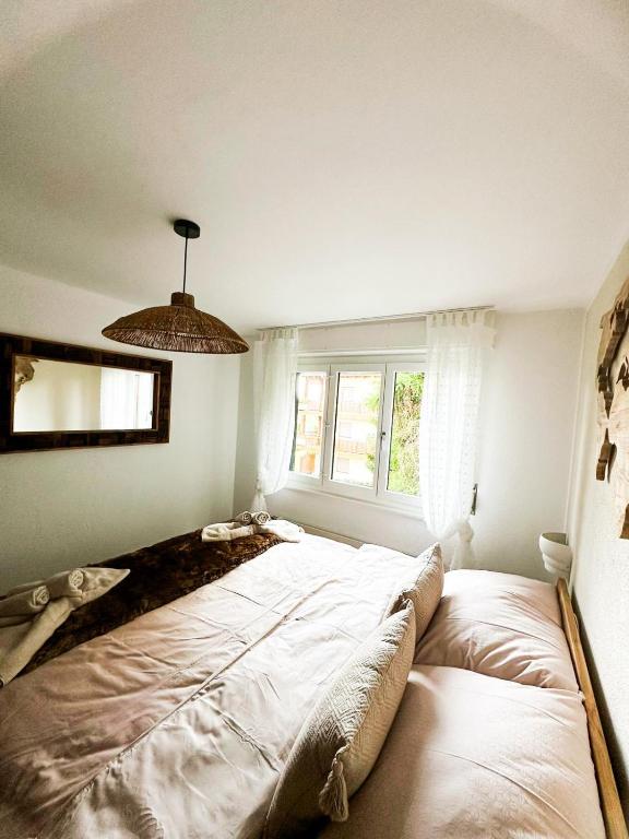 Postel nebo postele na pokoji v ubytování Charmant appartement avec vue splendide