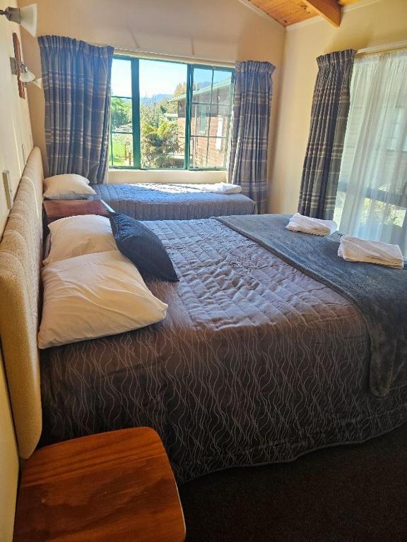 Postel nebo postele na pokoji v ubytování Kiwi Park Motels