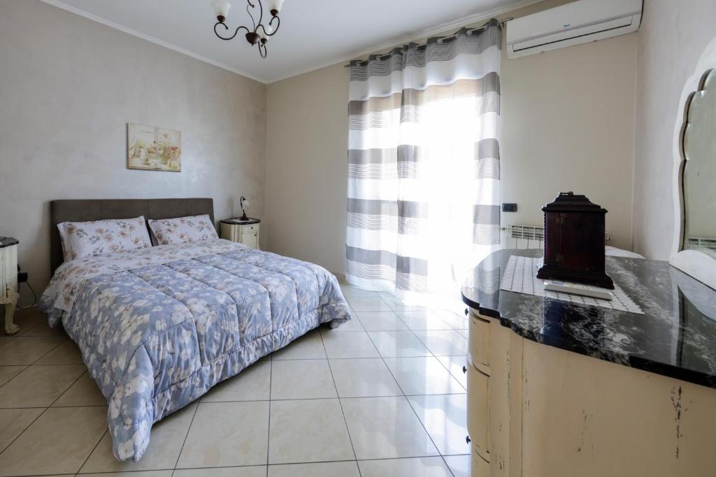 A bed or beds in a room at Villa Aurelia Pompei