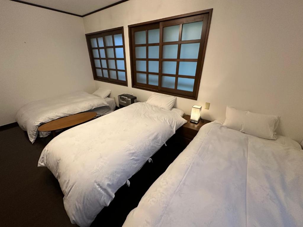 Letto o letti in una camera di Hakuba Third Place Lodge
