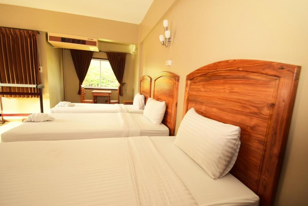 Postel nebo postele na pokoji v ubytování Best LD Hotel โรงแรมเบส แอลดี