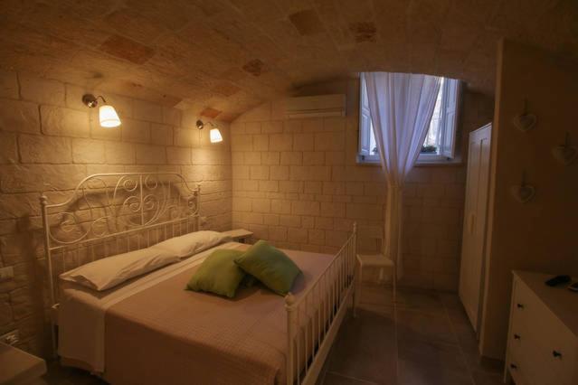 מיטה או מיטות בחדר ב-Casa Aurora 19