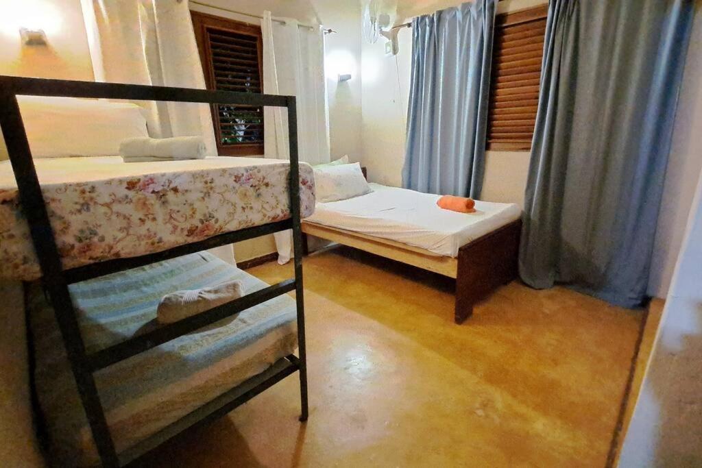 Postel nebo postele na pokoji v ubytování VILLA ANACAHUITA, Limonal