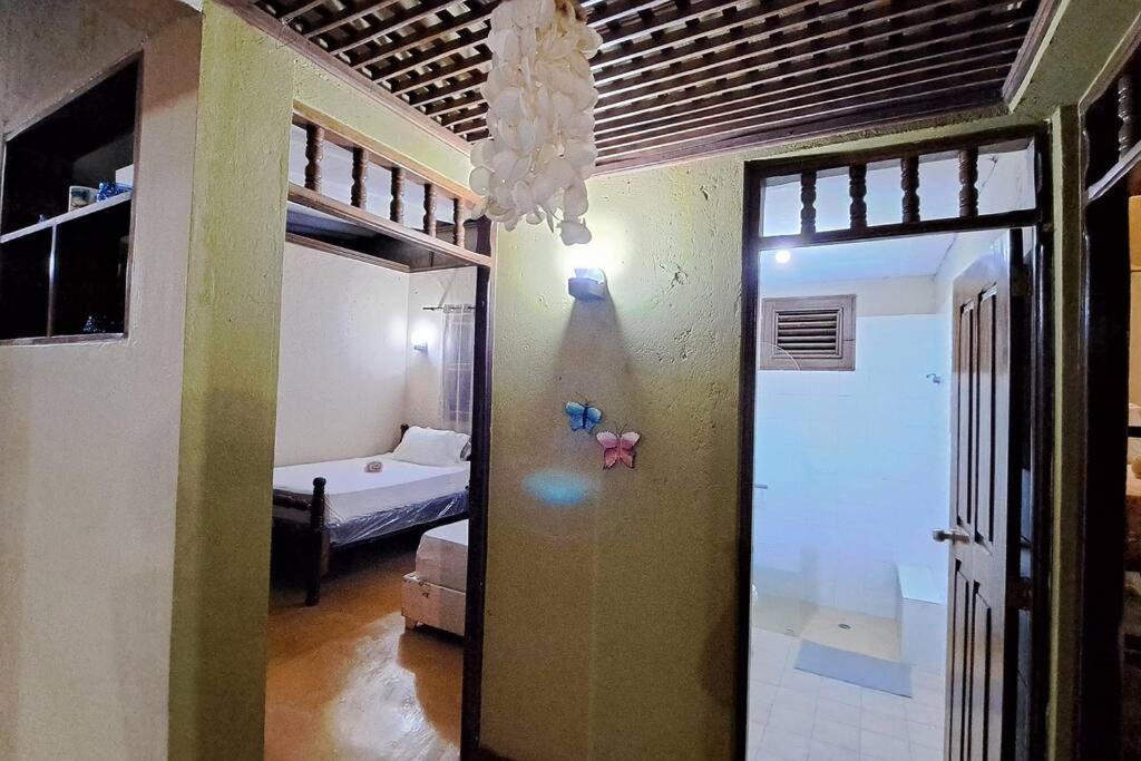 Postel nebo postele na pokoji v ubytování VILLA ANACAHUITA, Limonal
