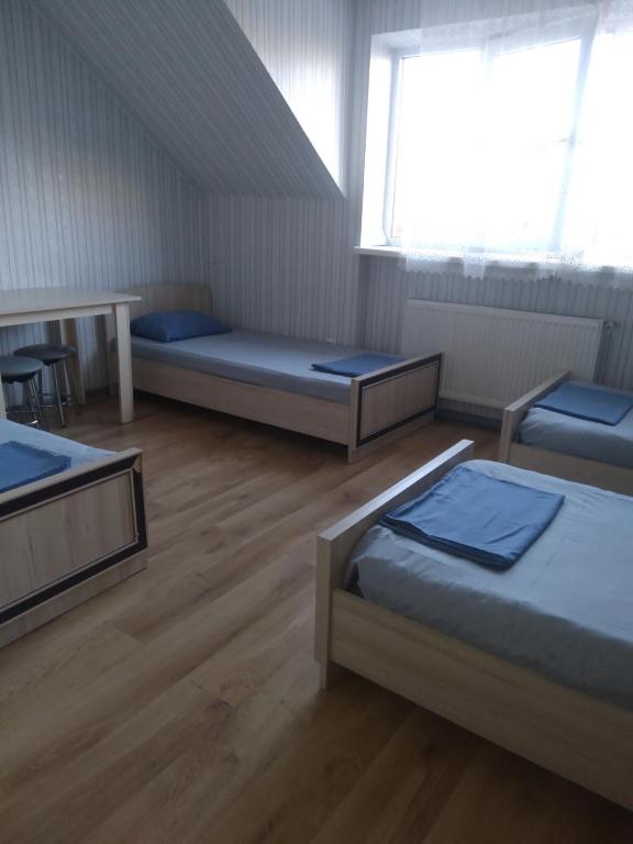 Postel nebo postele na pokoji v ubytování VIP hostel