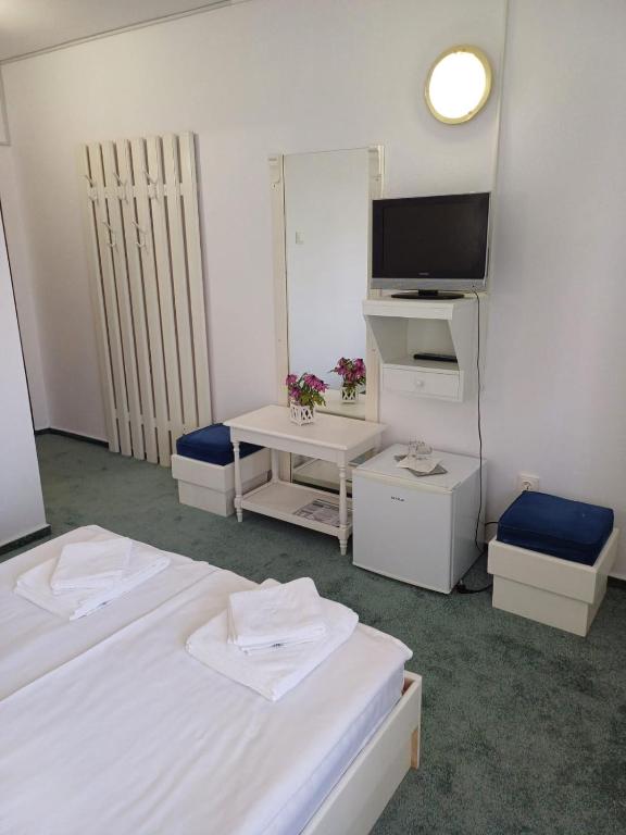 Postel nebo postele na pokoji v ubytování Hotel Hefaistos - Sovata
