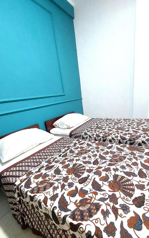 Postel nebo postele na pokoji v ubytování Riche Heritage Hotel
