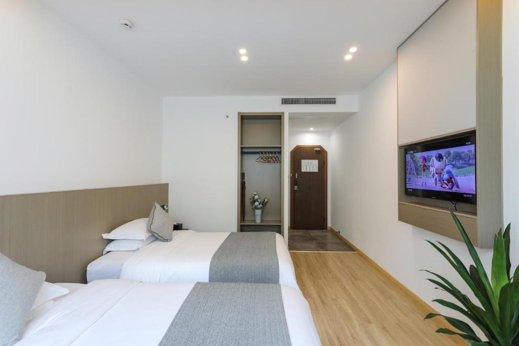 Postel nebo postele na pokoji v ubytování Wuzhen Residence B&B
