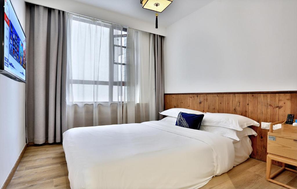 Postel nebo postele na pokoji v ubytování Wuzhen Residence B&B