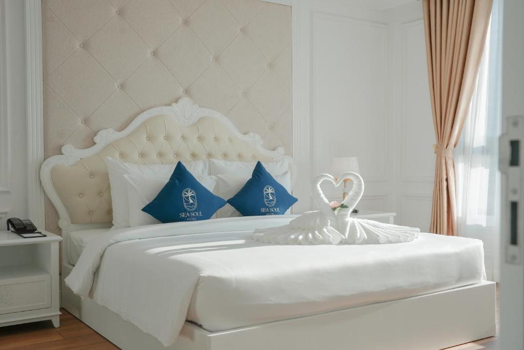 Giường trong phòng chung tại Sea Soul Hotel