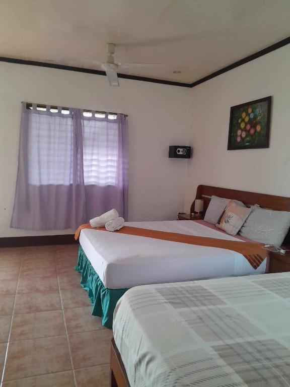 Postel nebo postele na pokoji v ubytování Bonita Oasis Beach Resort