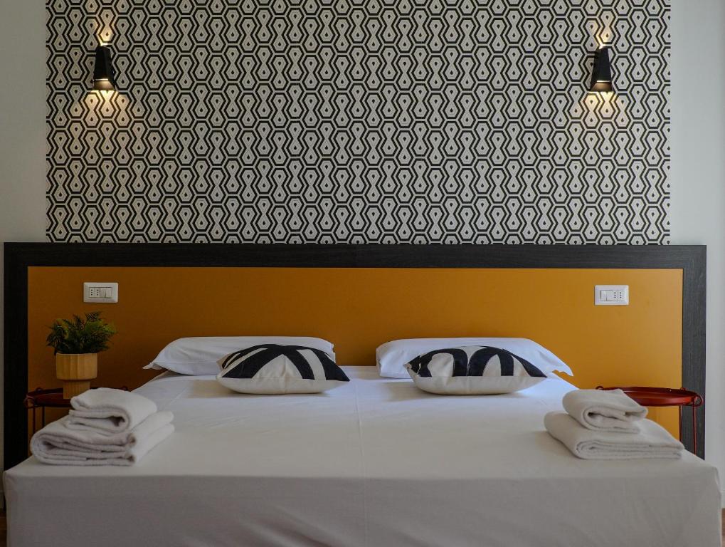 Postel nebo postele na pokoji v ubytování FEEL - Mille Suites