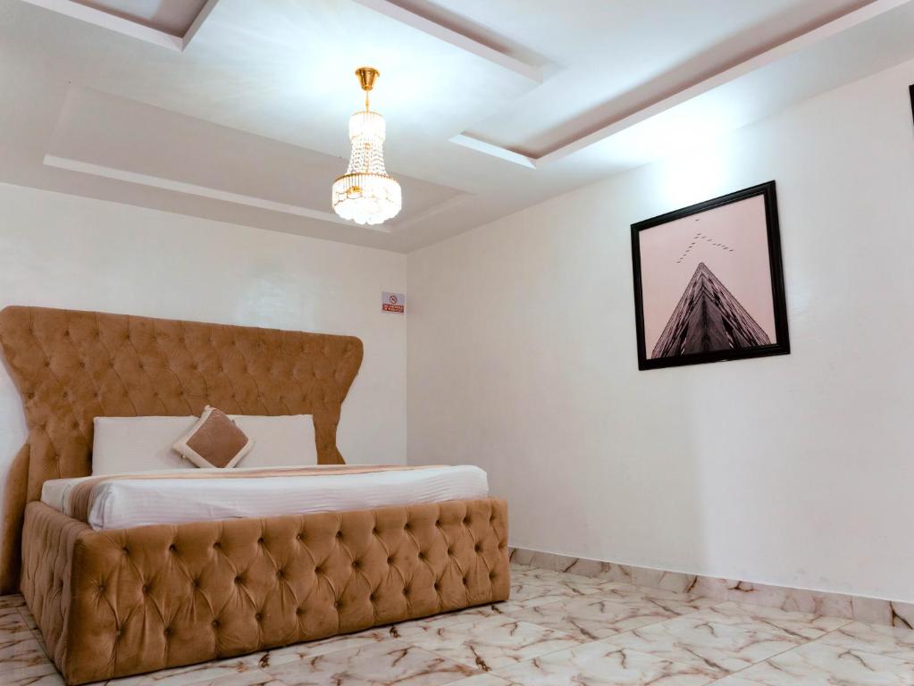 Postel nebo postele na pokoji v ubytování 247 Luxury Hotel