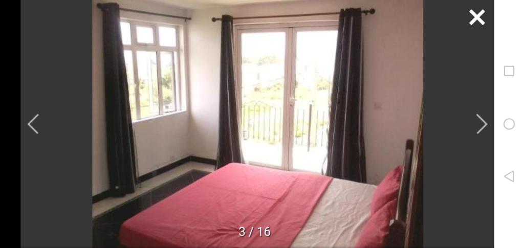 Una cama o camas en una habitación de Orchidée