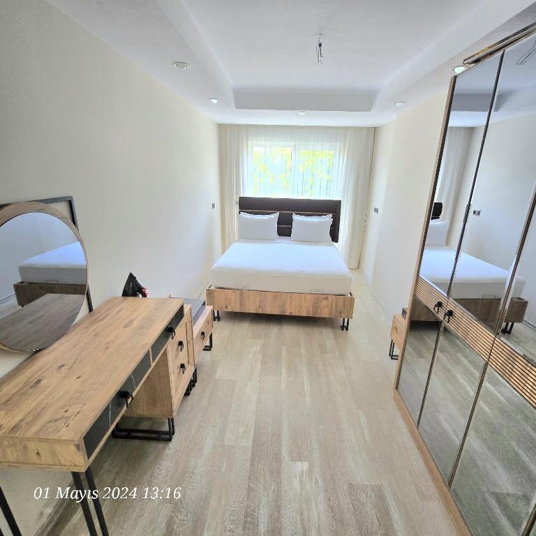 Postel nebo postele na pokoji v ubytování River Park Residence Lara