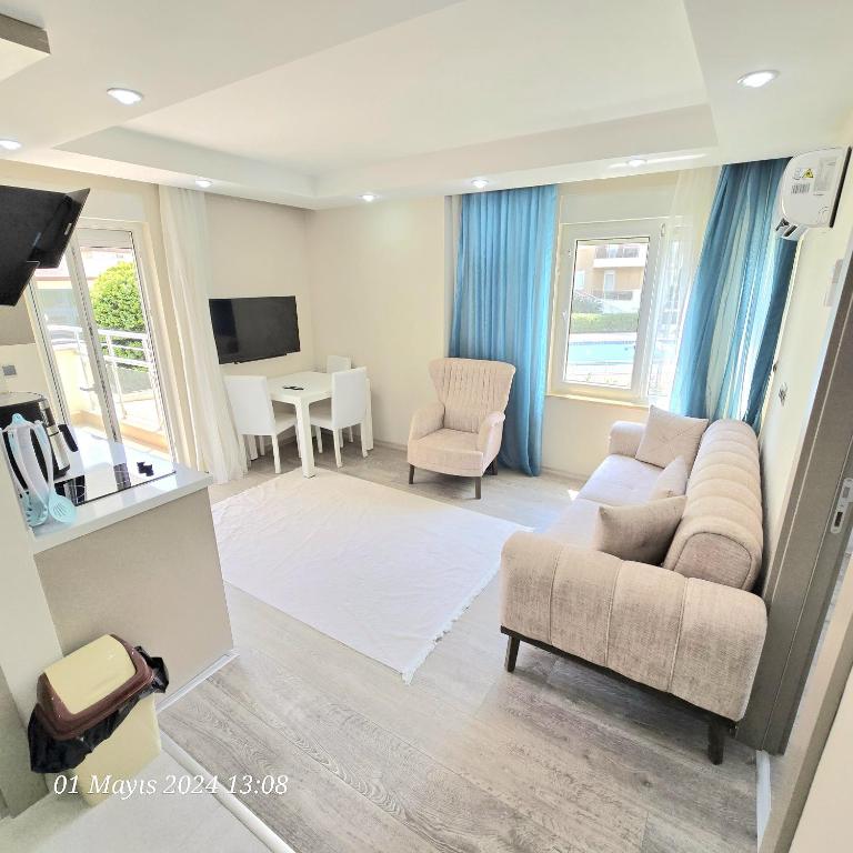 TV a/nebo společenská místnost v ubytování River Park Residence Lara