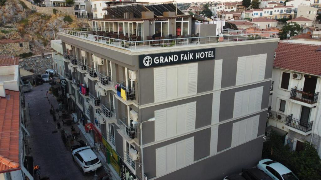 a building with a sign that reads grand park hotel at Grand Faik Hotel in Çeşme