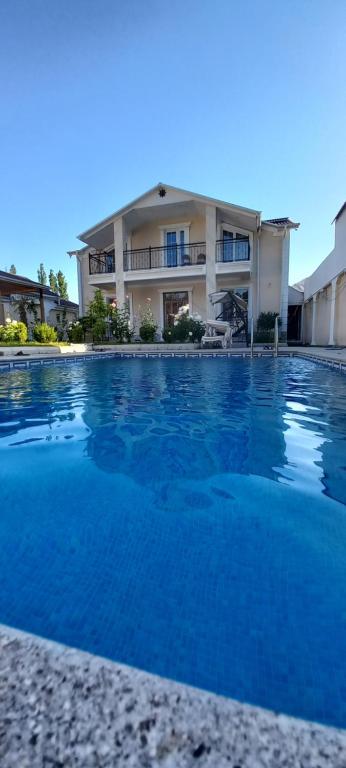 a large swimming pool in front of a building at DMC House in Gabala