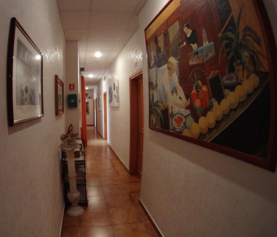 a hallway with a painting on the wall at Casa Cleo in Rome