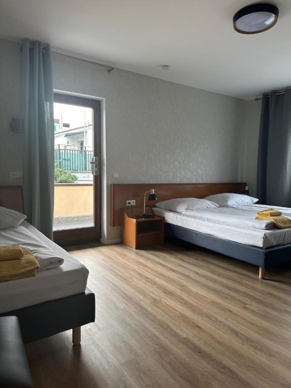 Postel nebo postele na pokoji v ubytování Hotel Pirol