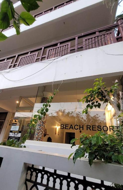a store window with the words beach rescue on it at tippys beach resort in Kovalam