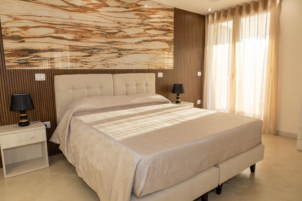 Postel nebo postele na pokoji v ubytování Global Hotel