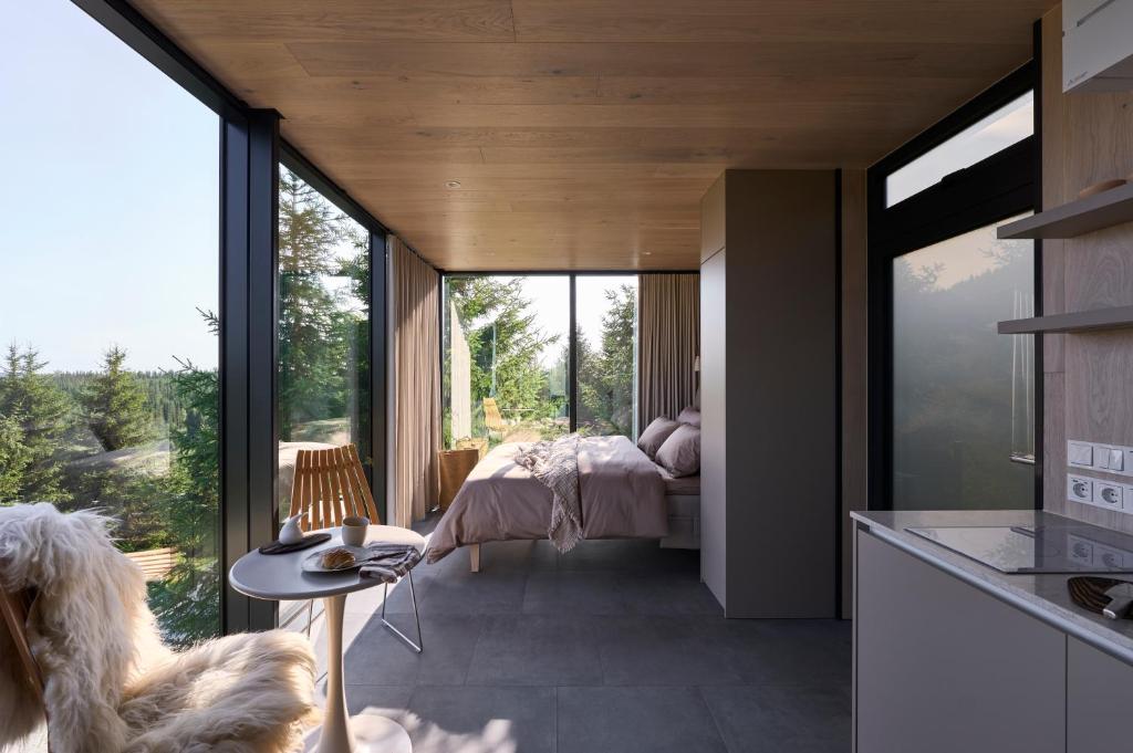 Ένα ή περισσότερα κρεβάτια σε δωμάτιο στο Furu Natur & Kultur