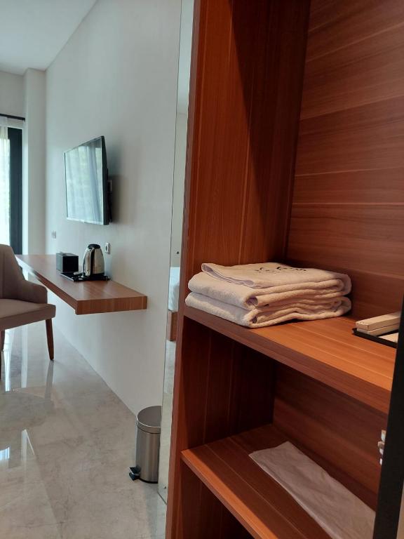 Postel nebo postele na pokoji v ubytování Gemma Hotel Balige
