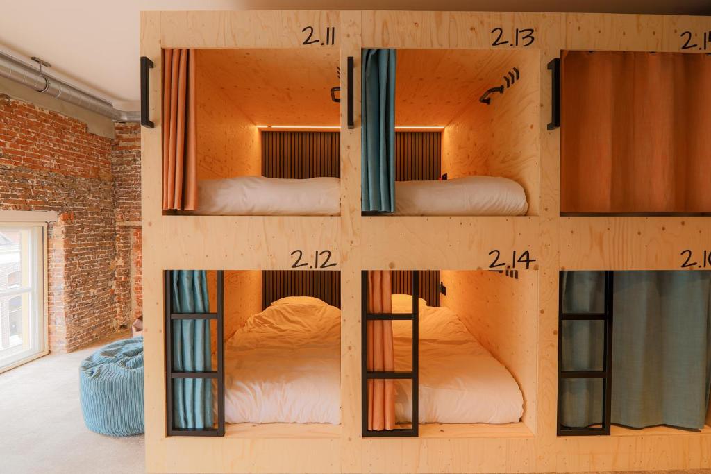 Postel nebo postele na pokoji v ubytování PJs Hostel