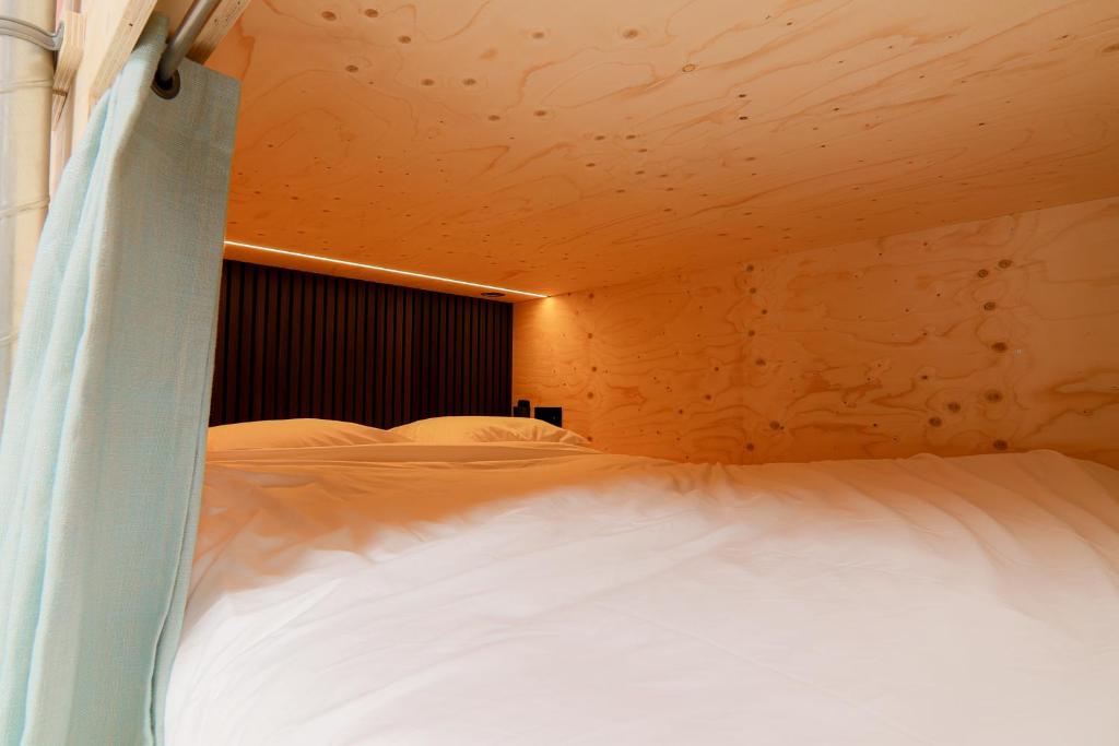 Postel nebo postele na pokoji v ubytování PJs Hostel
