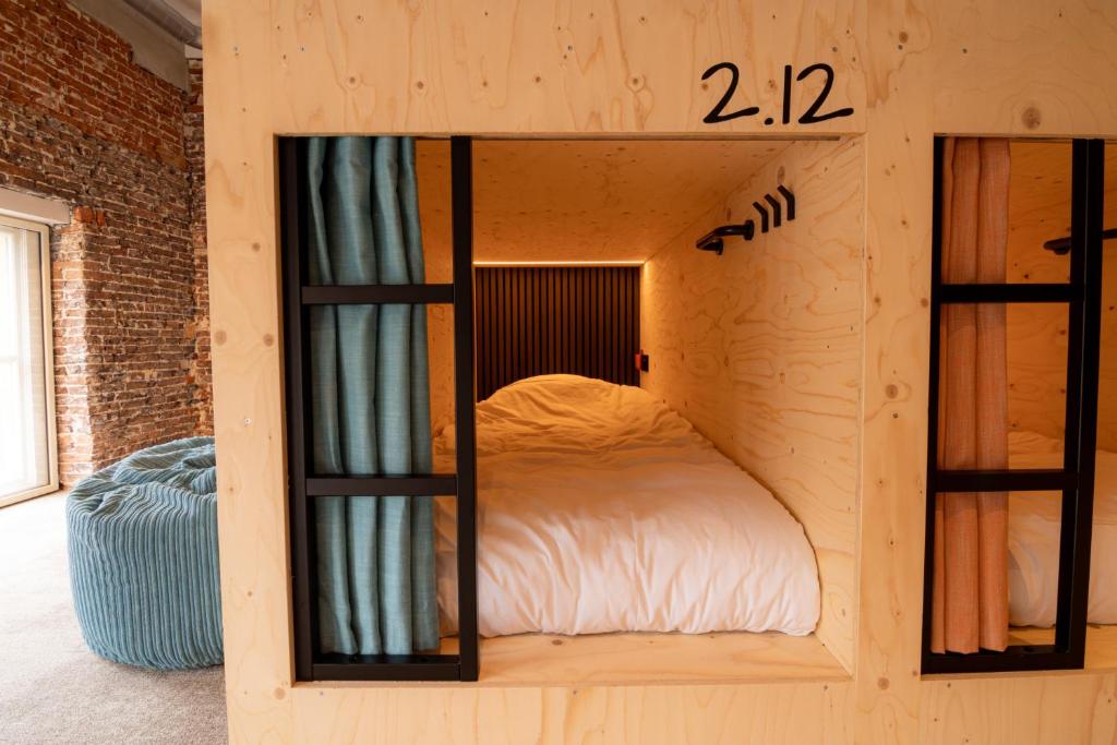 Postel nebo postele na pokoji v ubytování PJs Hostel