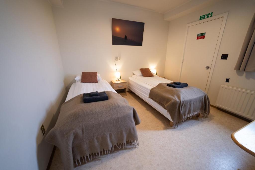 Postel nebo postele na pokoji v ubytování Snæfellsjökull Apartments
