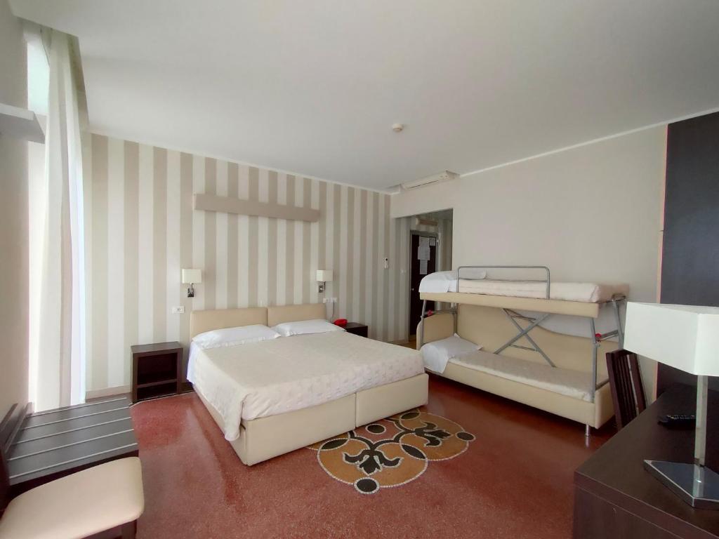 Posteľ alebo postele v izbe v ubytovaní Hotel Vittoria