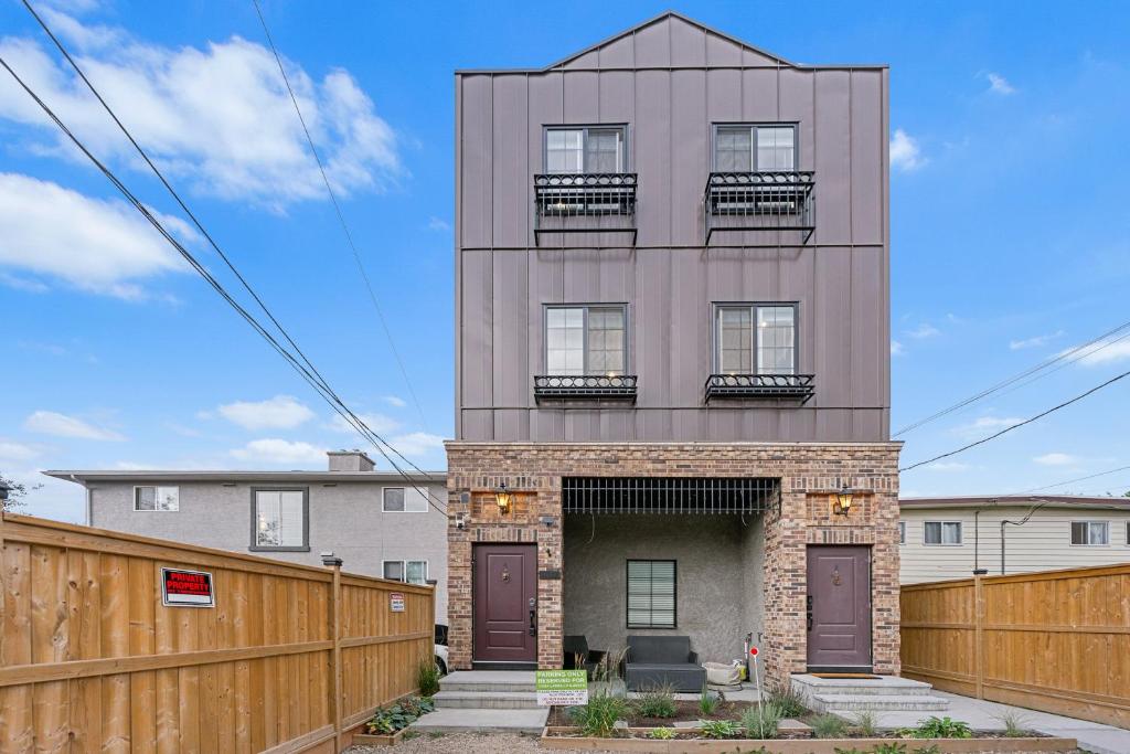 a tall building with two balconies on top of it at Casa Ladrillo - House of Bricks in Calgary
